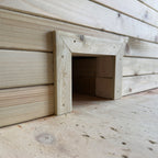 Wooden planter with a built-in hedgehog house