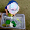 child playing at washing up