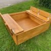 outdoor wooden sandpit with lid and seats