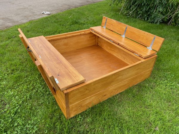 outdoor wooden sandpit with lid and seats